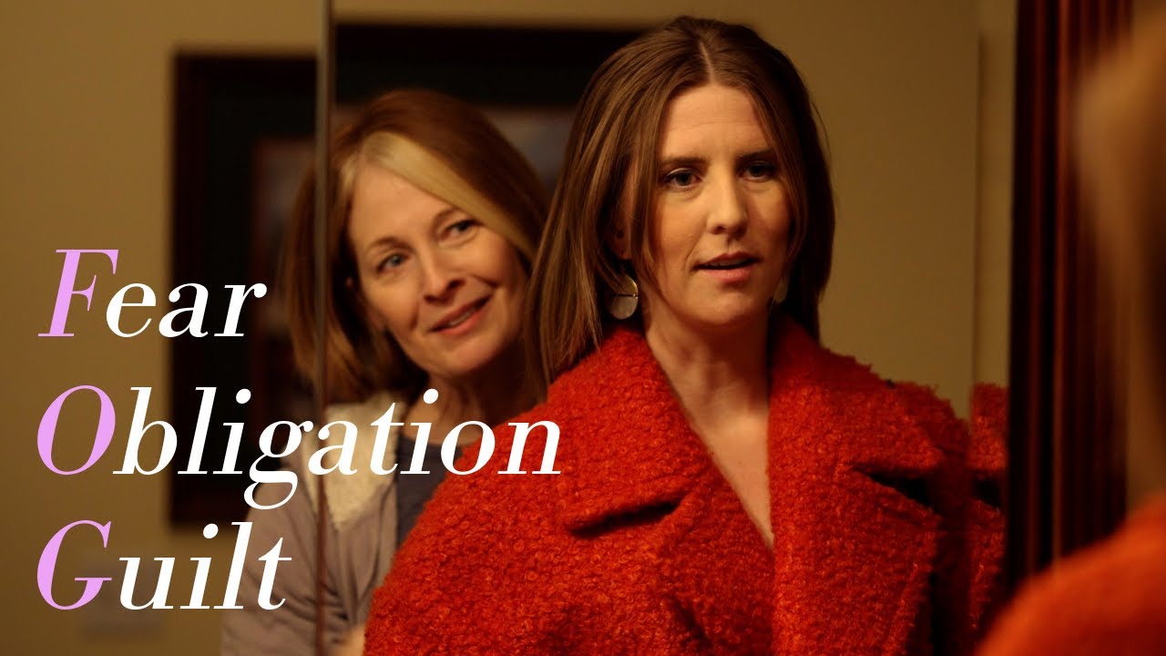 FOG trailer: Jane in a red coat with her mother behind her, titled Fear, Obligation, Guilt. Click to play.